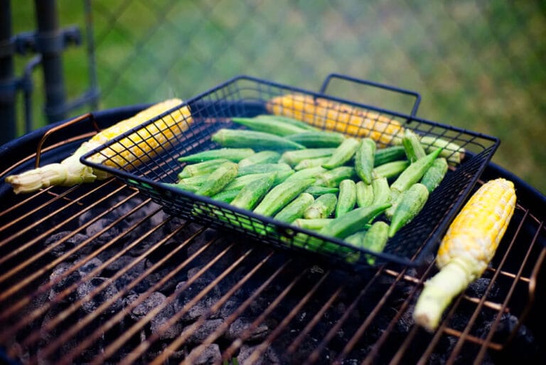 grilling basket on charcoal grill outdoors during summer